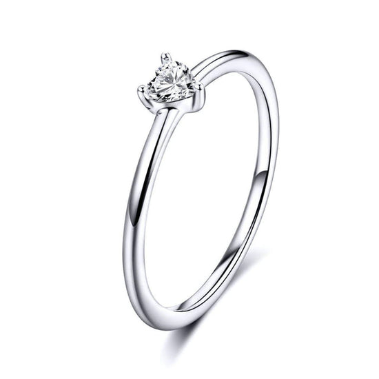Women's Dainty Sterling Silver Love Ring: Heart Shaped  Add a special sparkle to your ring stack with this adorable and dainty heart shaped cubic zirconia crystal silver ring.   This thin sterling silver ring is a staff favourite. Part of the Women's Silver Jewellery Collection.