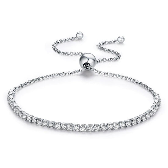 Silver Cubic Zirconia Pave Crystal Bracelet: Adjustable Sliding Bead  Crafted with sterling silver and cubic zirconia, this crystal covered pave bracelet is the perfect addition to any sparkling jewellery collection. Adjust this beautiful bracelet from a size small to large with the sliding bead made from genuine sterling silver (hallmarked 925).   This sparkling adjustable sliding bed bracelet is part of the Women's Silver Jewellery Collection.